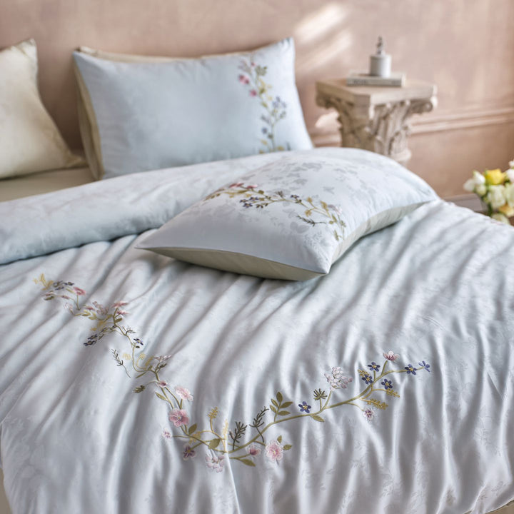 Satin bedding set with fine floral embroidery and jacquard structure