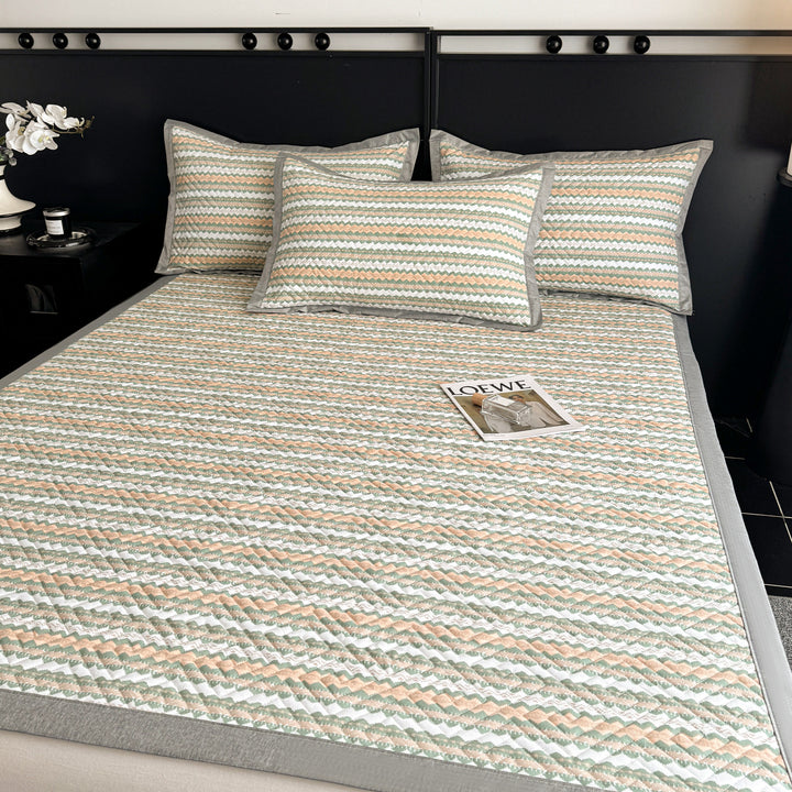 Quilted bedspread and pillow set with geometric striped quilting