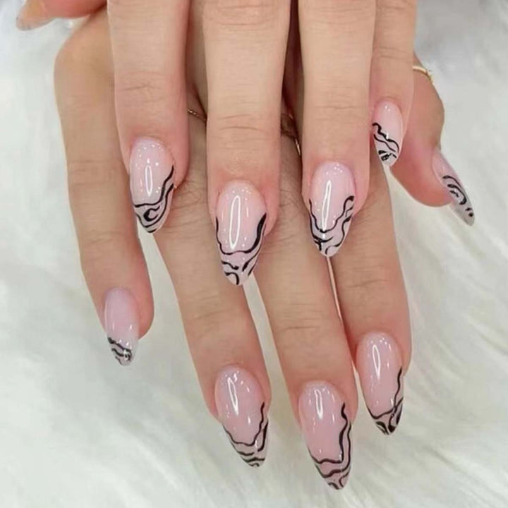 Artful stiletto nails with modern line patterns Stornfield