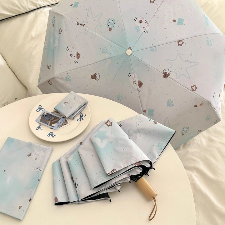 Women's compact folding umbrella with cute Stornfield motif
