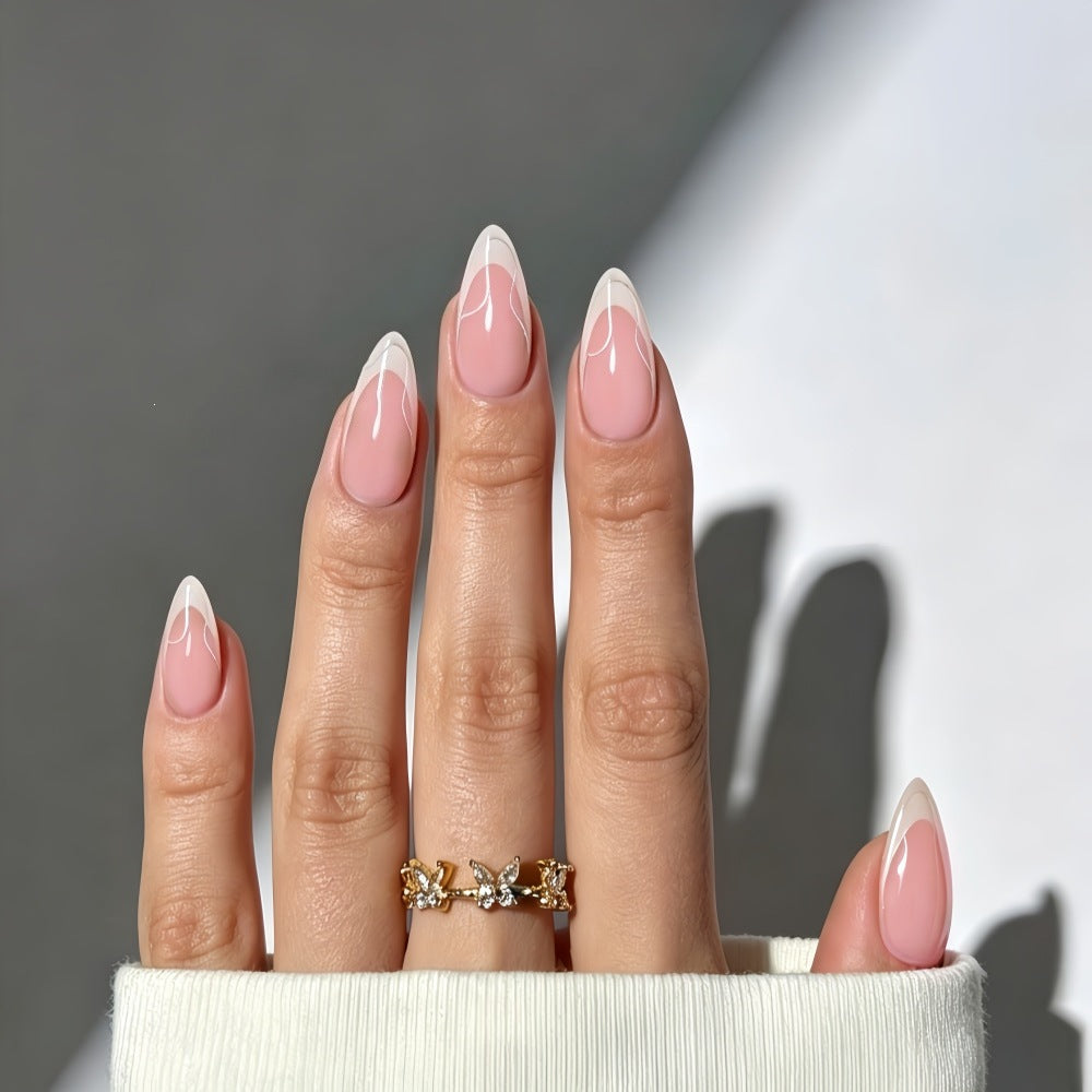 Artificial nails with elegant French design and curved accents Stornfield