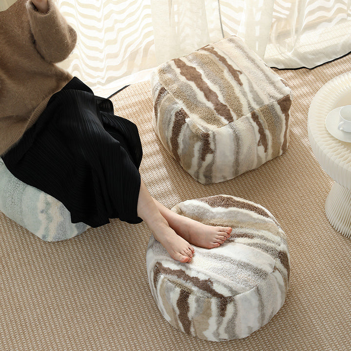 Round seating pouf made of teddy fleece with soft textured cover