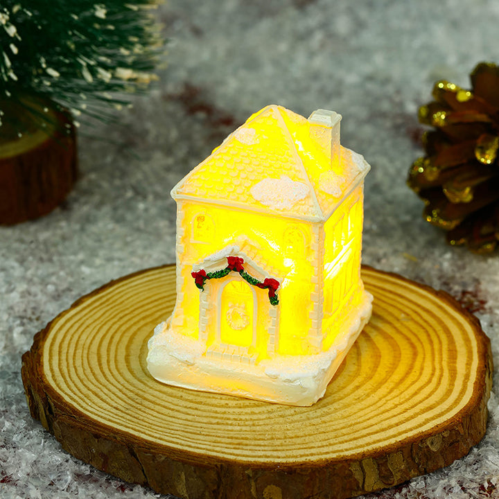 Illuminated Christmas village house with festive decoration Stornfield