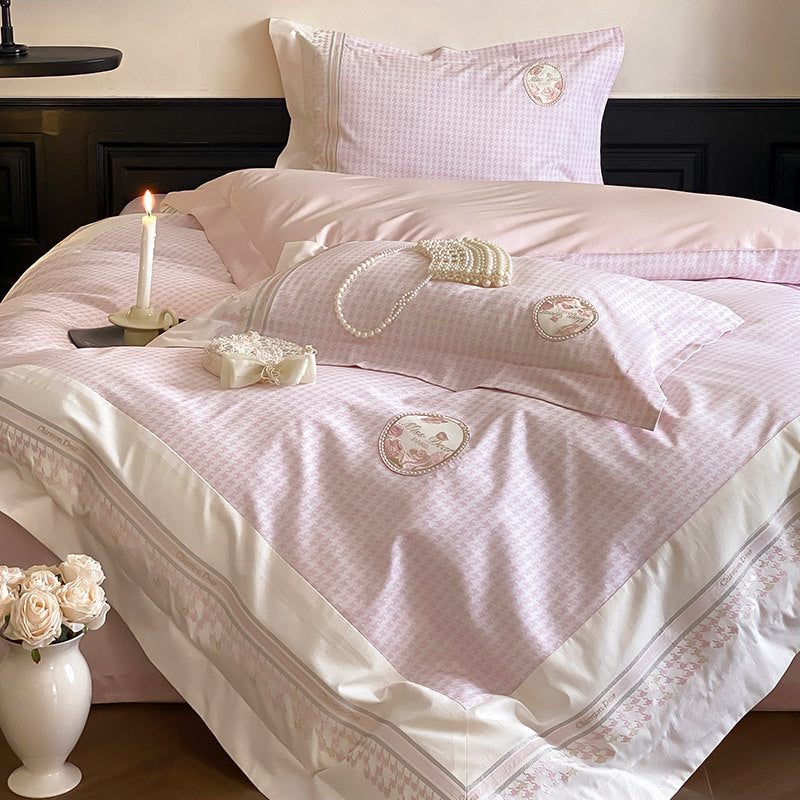 Luxurious cotton satin bedding set with embroidered medallion applications and fine edging