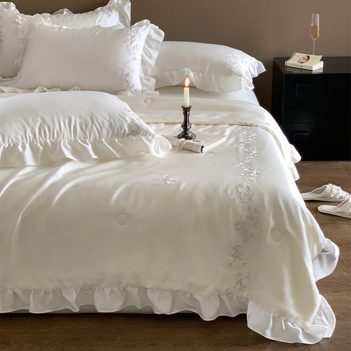Satin bedding set with ruffled hem and fine rose embroidery