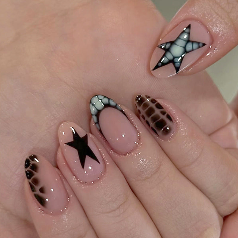 Artistic Press-On Nail Set with Star and Animal Print Accents Stornfield