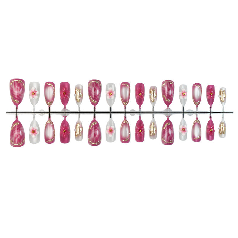 Acrylic nail set with floral accents and glitter details Stornfield