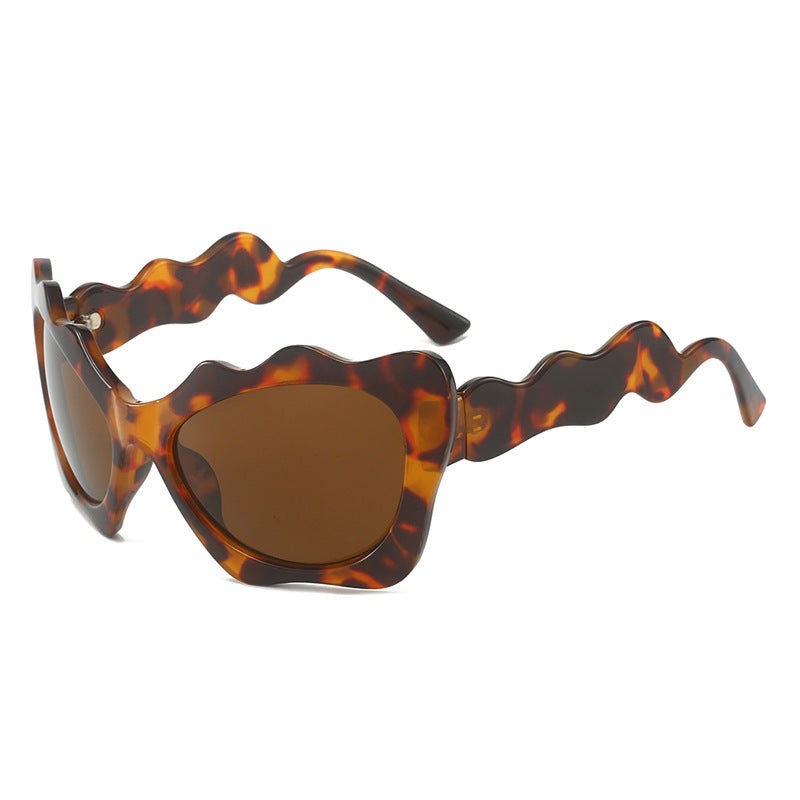 Ladies extravagant sunglasses with wavy frame design Stornfield