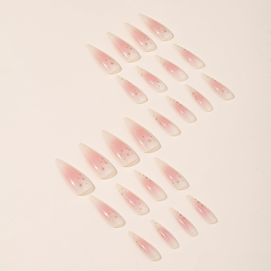 Acrylic nail set with delicate ombre design and glamorous star accents Stornfield