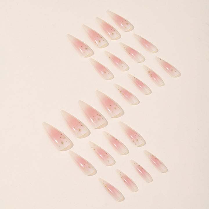 Acrylic nail set with delicate ombre design and glamorous star accents Stornfield