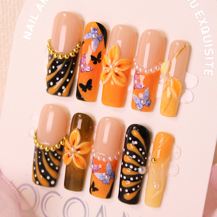 Artificial nail set with elegant flower and butterfly designs Stornfield