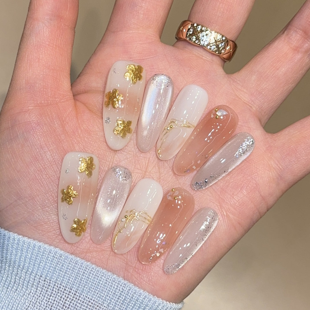 Artificial nails with floral decorations and glitter effects Stornfield