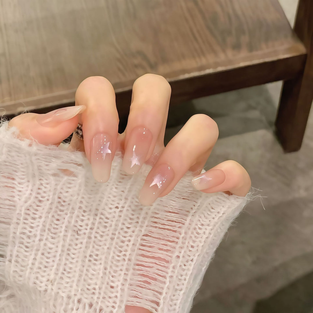 Artificial nails with sparkling stars and gentle gradient Stornfield