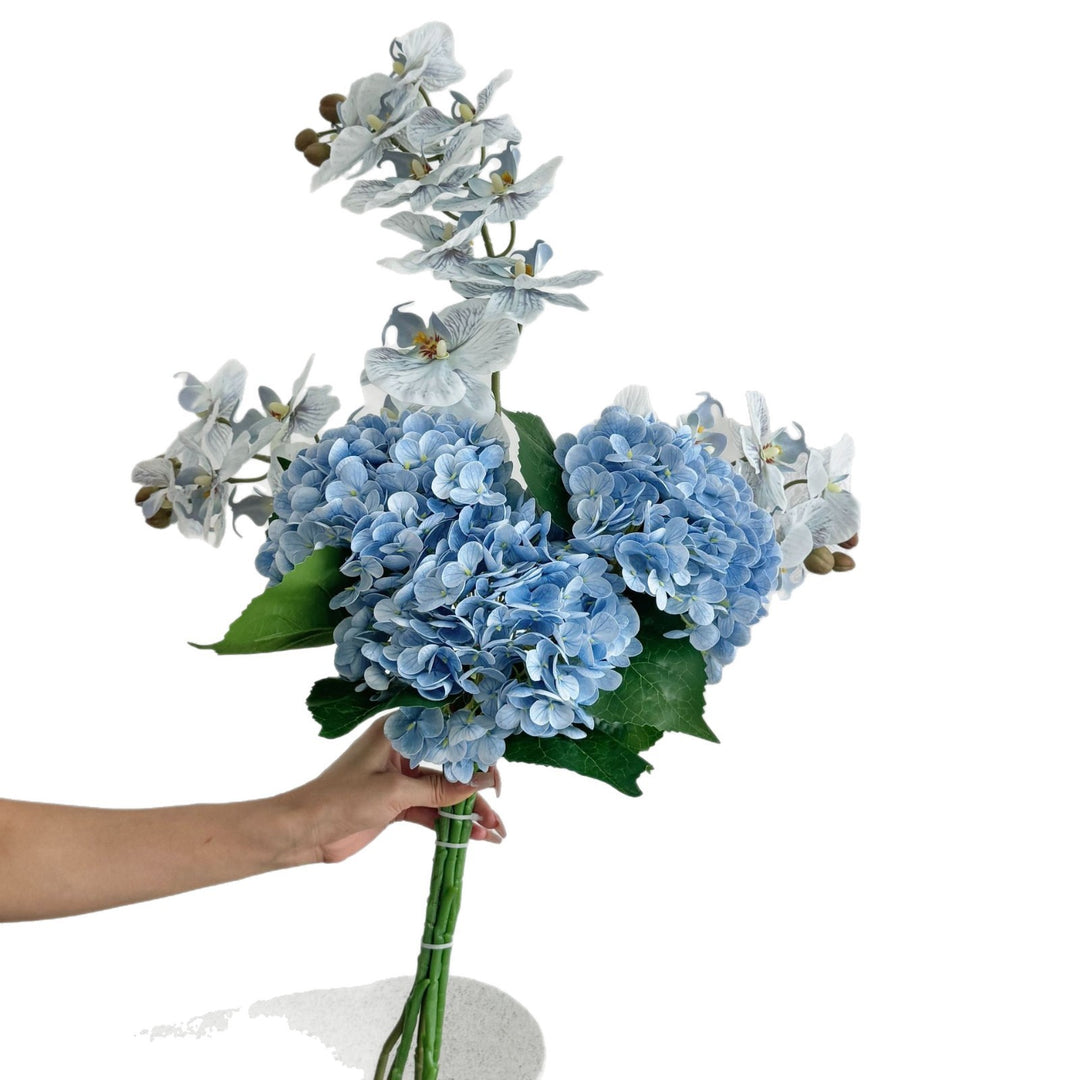 Luxurious artificial flower bouquet with blooming orchids
