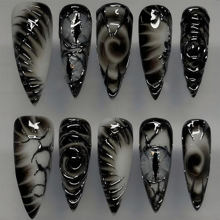 Artificial nail set with modern spiral pattern and shiny accents Stornfield