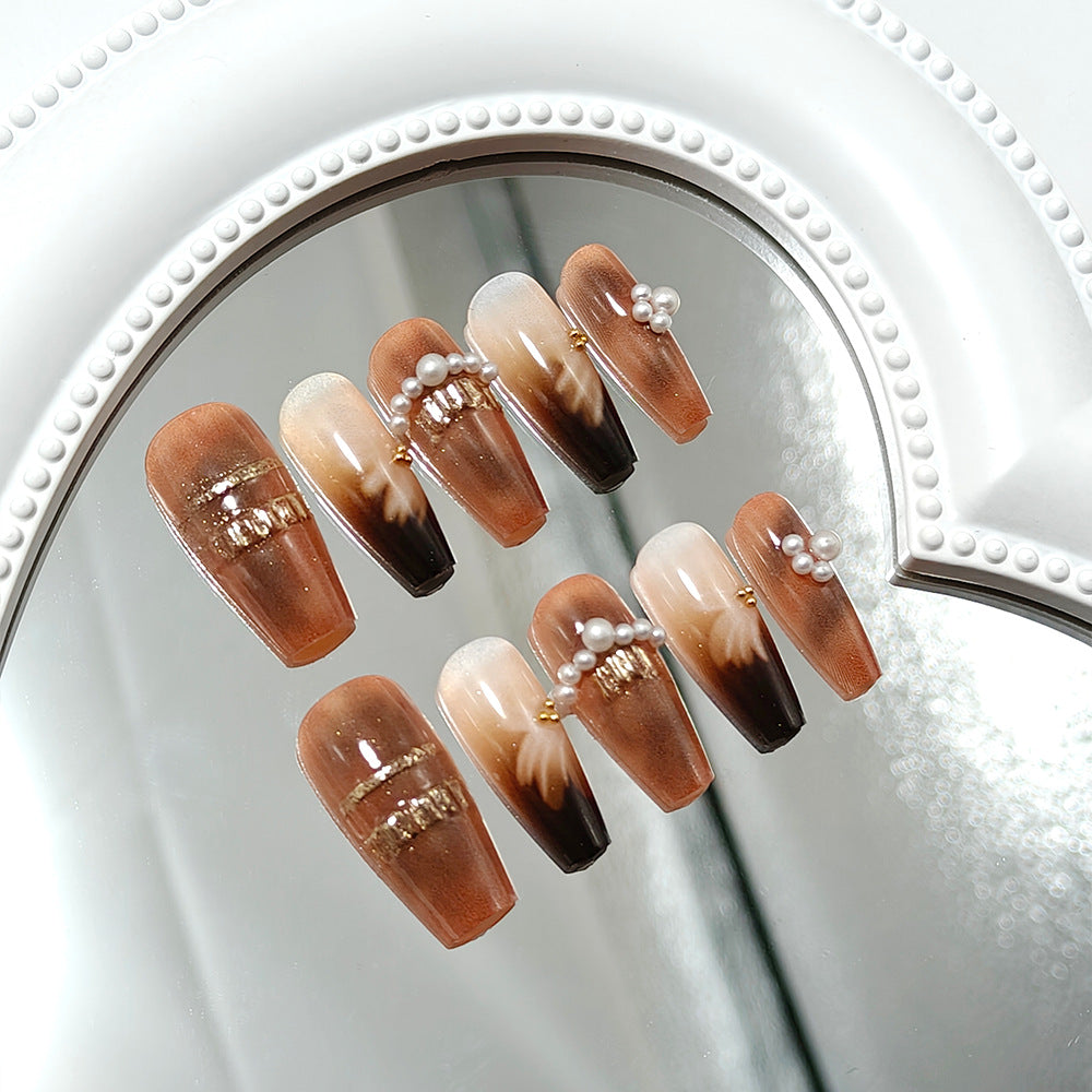 Artificial nails with elegant pearl and gold accents Stornfield