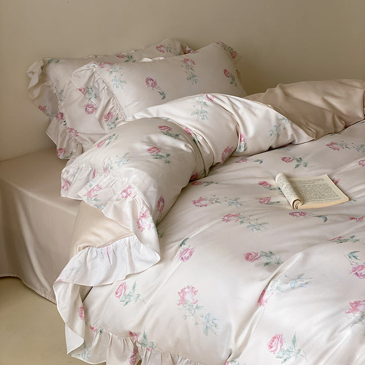 Luxurious satin bedding set with delicate rose pattern and ruffled hem