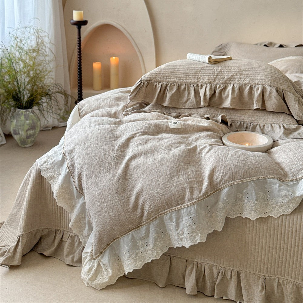 Luxurious quilted cotton bedding set with ruffles and embroidered details