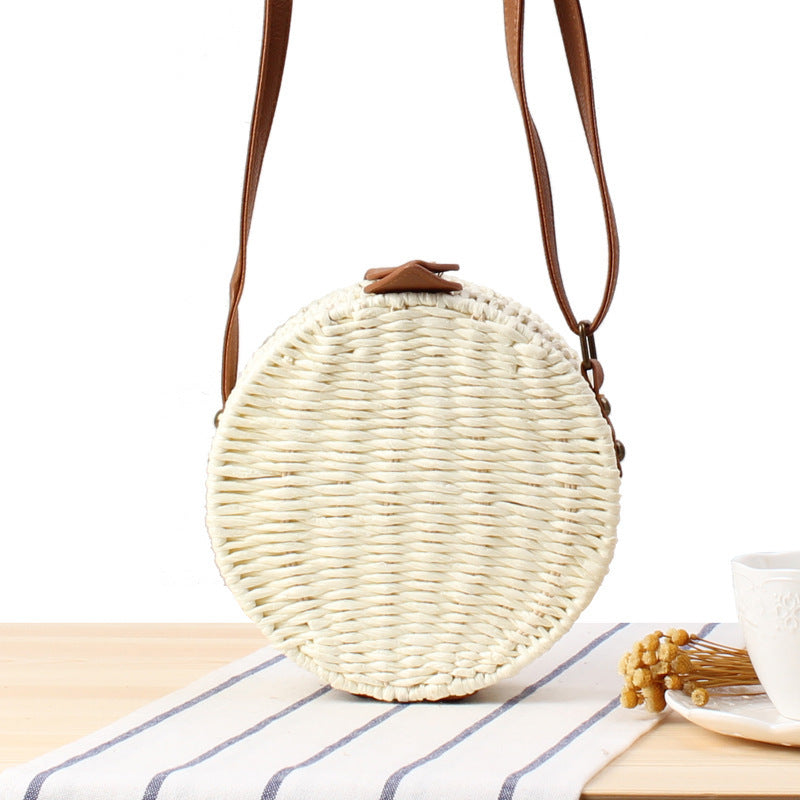 Round basket bag with leather accents Stornfield