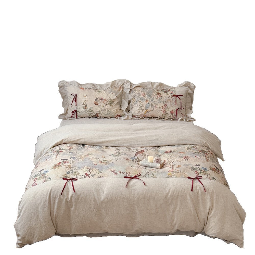 Bedding set with floral vintage linen look, ruffled pillow and bow tie