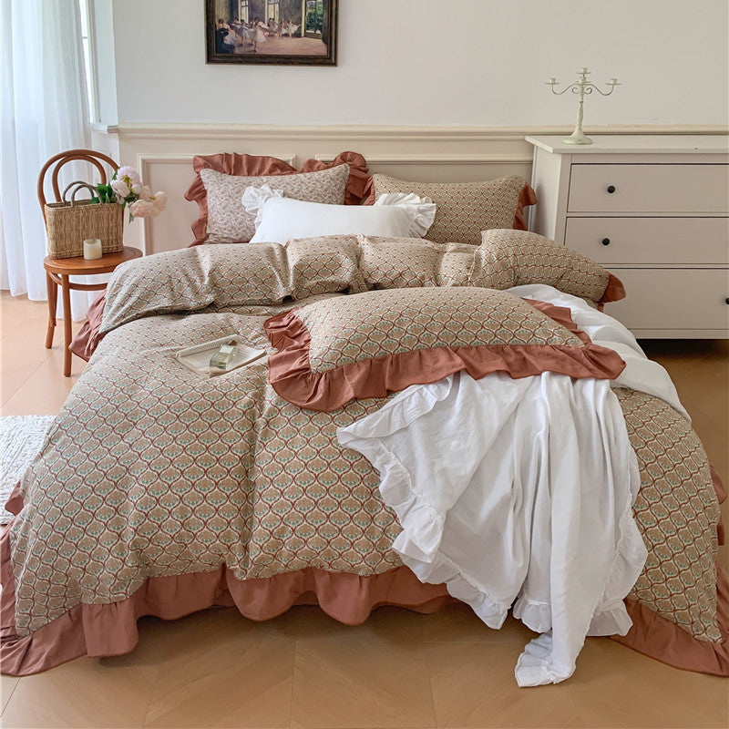 Romantic bed linen complete set made of cotton percale with delicate floral print, ruffle trim, and silky-matte finish