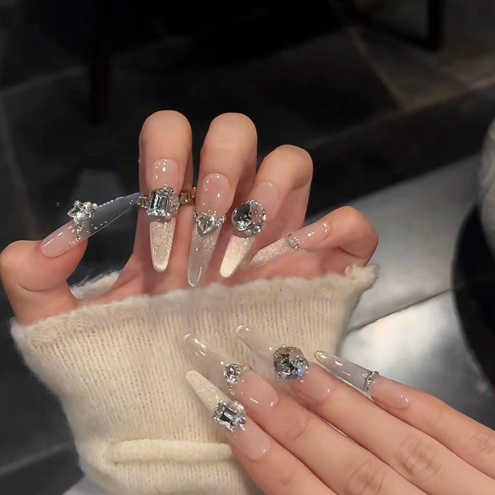 Glamorous artificial nails with sparkling rhinestone embellishments Stornfield