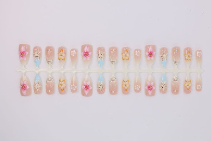 Artificial nail set with floral motifs and radiant accents Stornfield