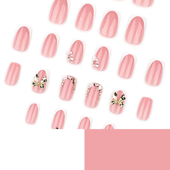 Elegant Nail Extensions with French Tips and Decorative Accents Stornfield
