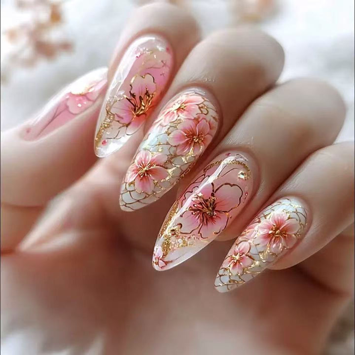 Artificial nails with floral accents and golden details Stornfield