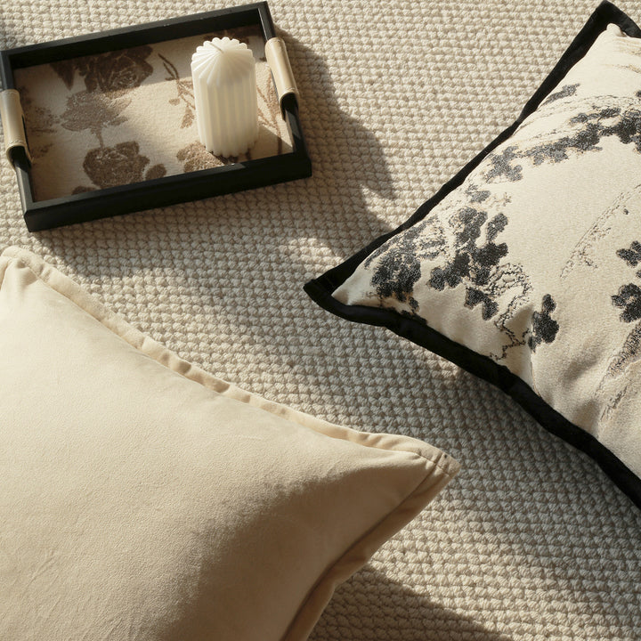 Elegant decorative pillow with intricate landscape illustration