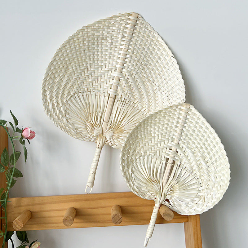 Women hand-woven fan made of natural material Stornfield