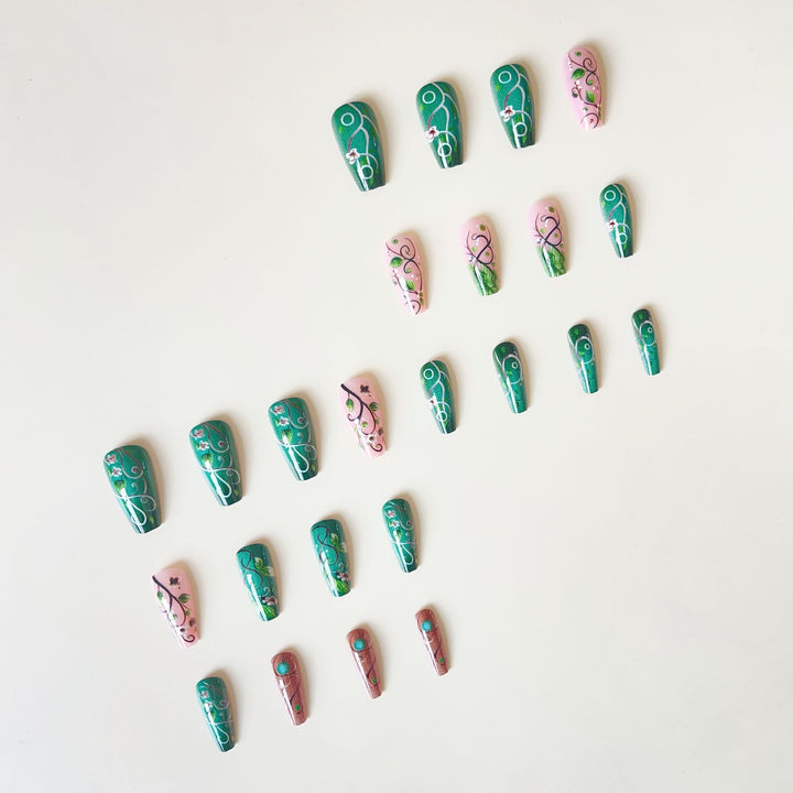 luxurious artificial nail set with floral designs and detailed accents Stornfield