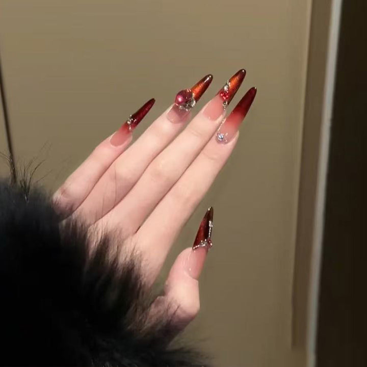 Artificial nails with glamorous rhinestone decorations Stornfield
