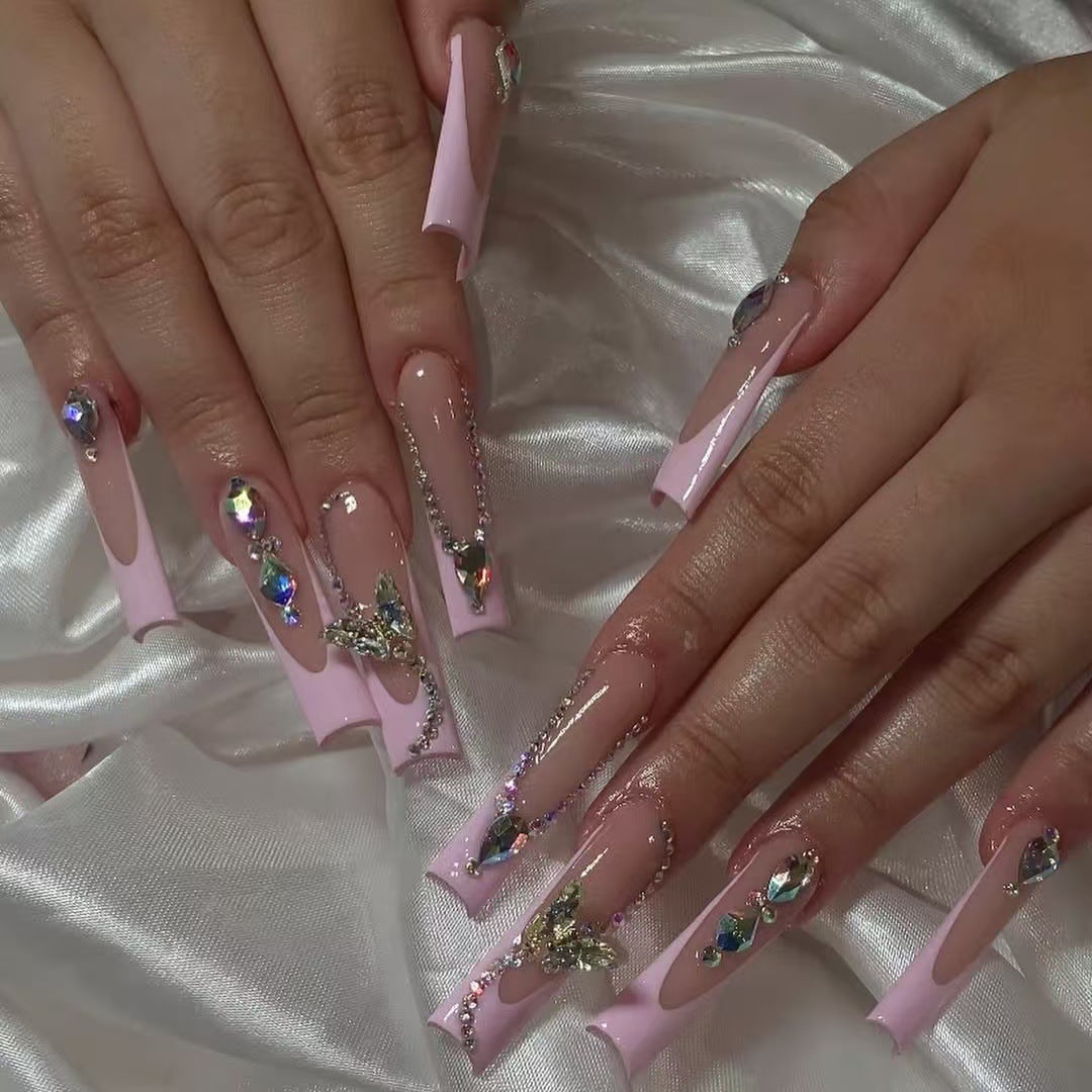 Acrylic nail set with elegant glitter and rhinestone accents Stornfield