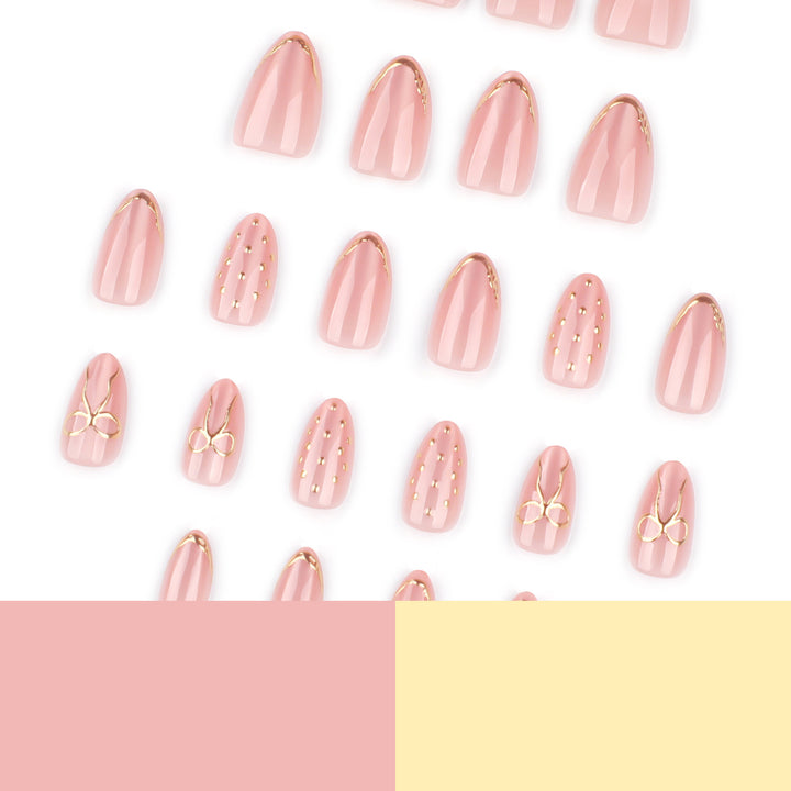 Artful nail extensions with elegant golden accents Stornfield