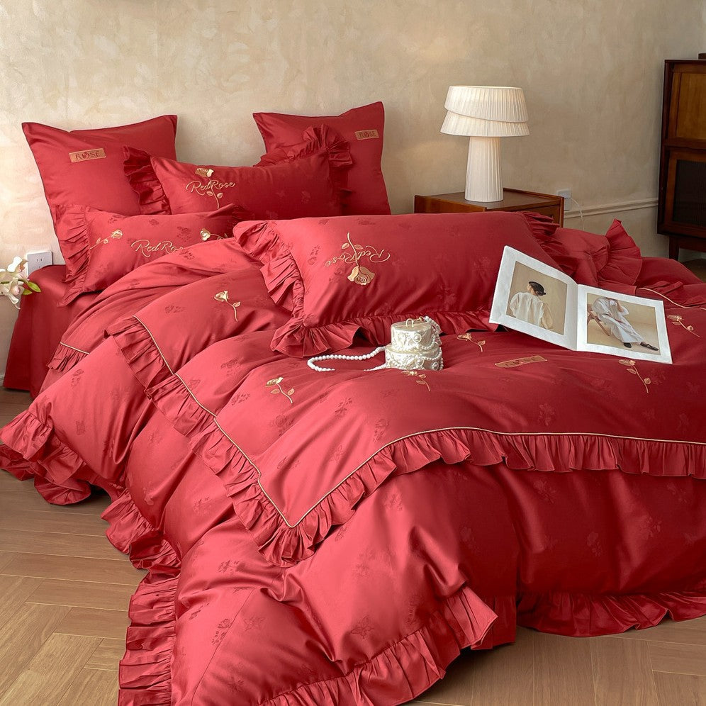 Romantic satin bedding set with ruffles, fine floral embroidery, and reversible pillowcase