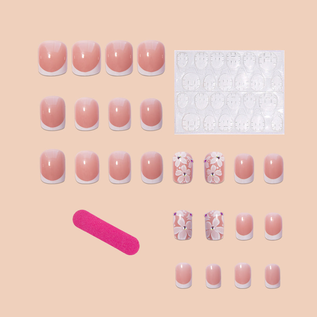 Artificial nail set with elegant French design and floral accents Stornfield