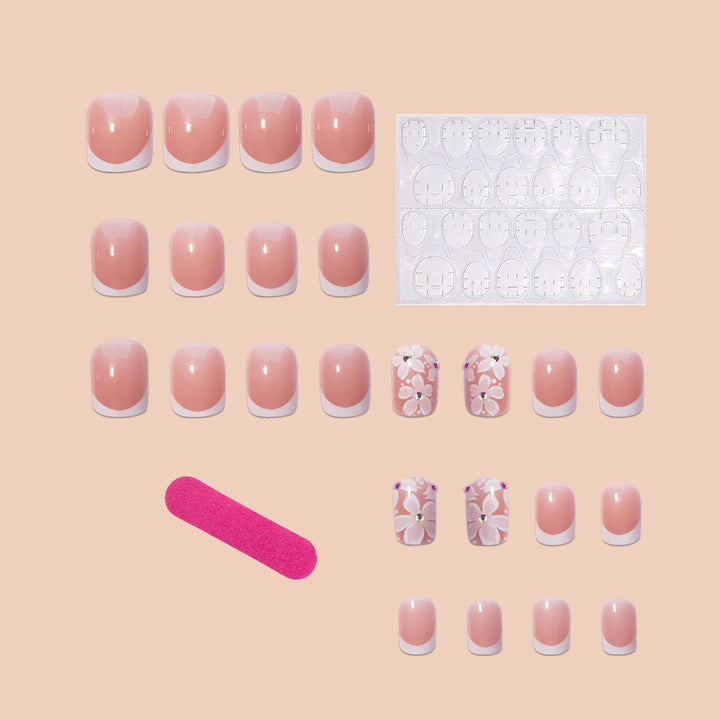 Artificial nail set with elegant French design and floral accents Stornfield
