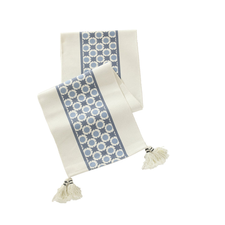 Web table runner made of cotton blend with woven diamond design and tassels