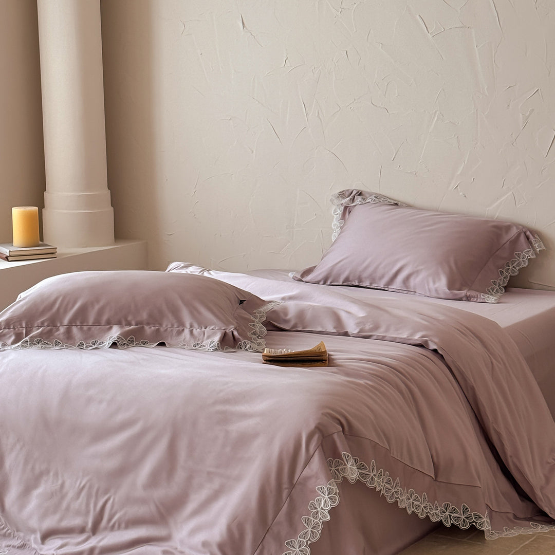 Satin bedding set with silky-smooth texture and floral lace trim