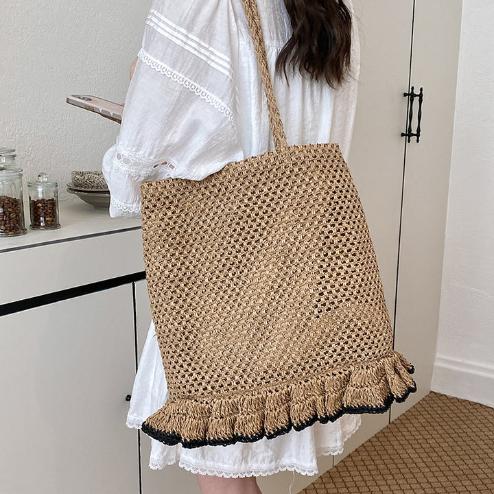 Handcrafted straw bag with fringed hem Stornfield