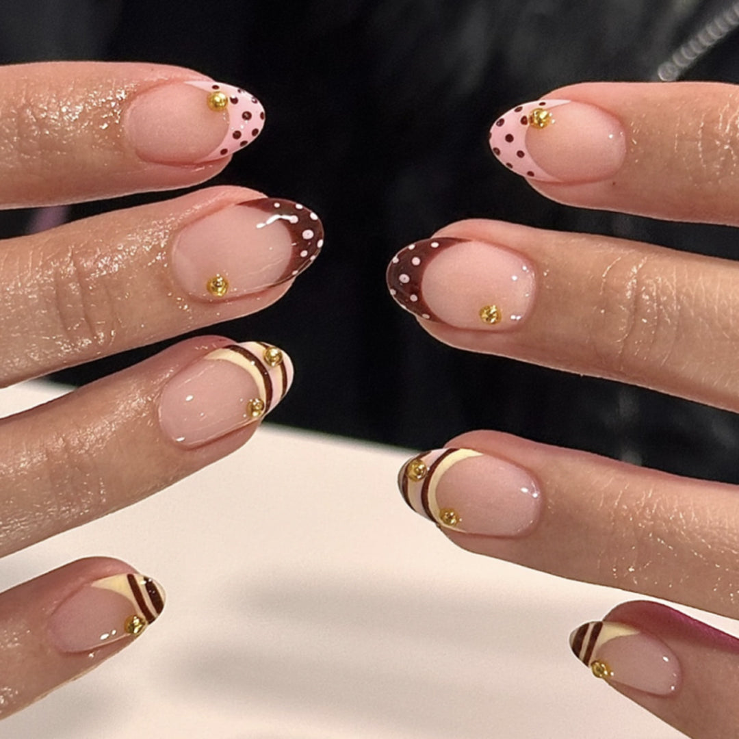 Artful stiletto nails with elegant floral design and glitter details Stornfield