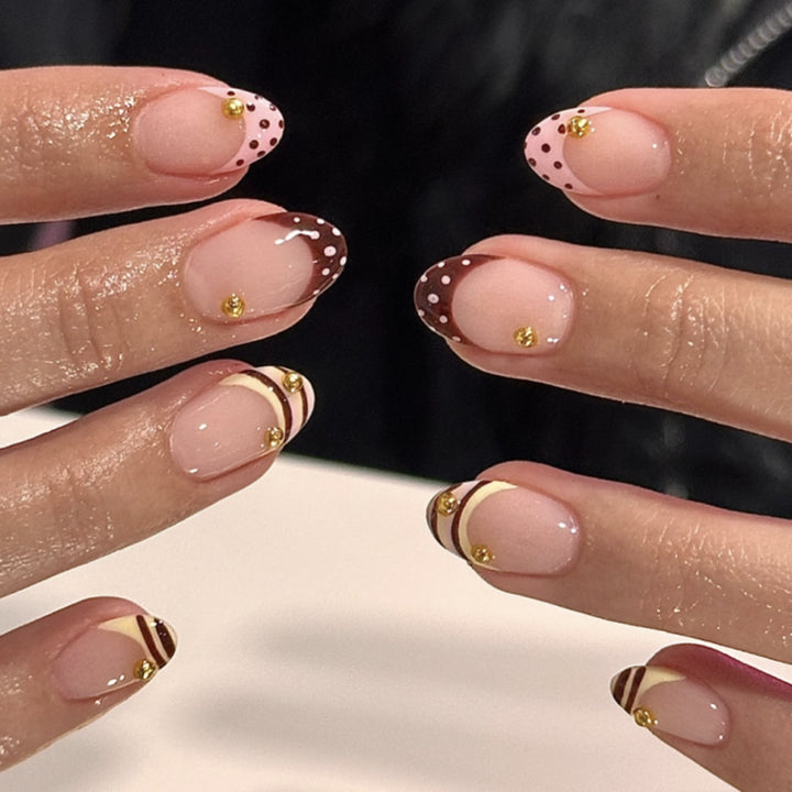 Artful stiletto nails with elegant floral design and glitter details Stornfield