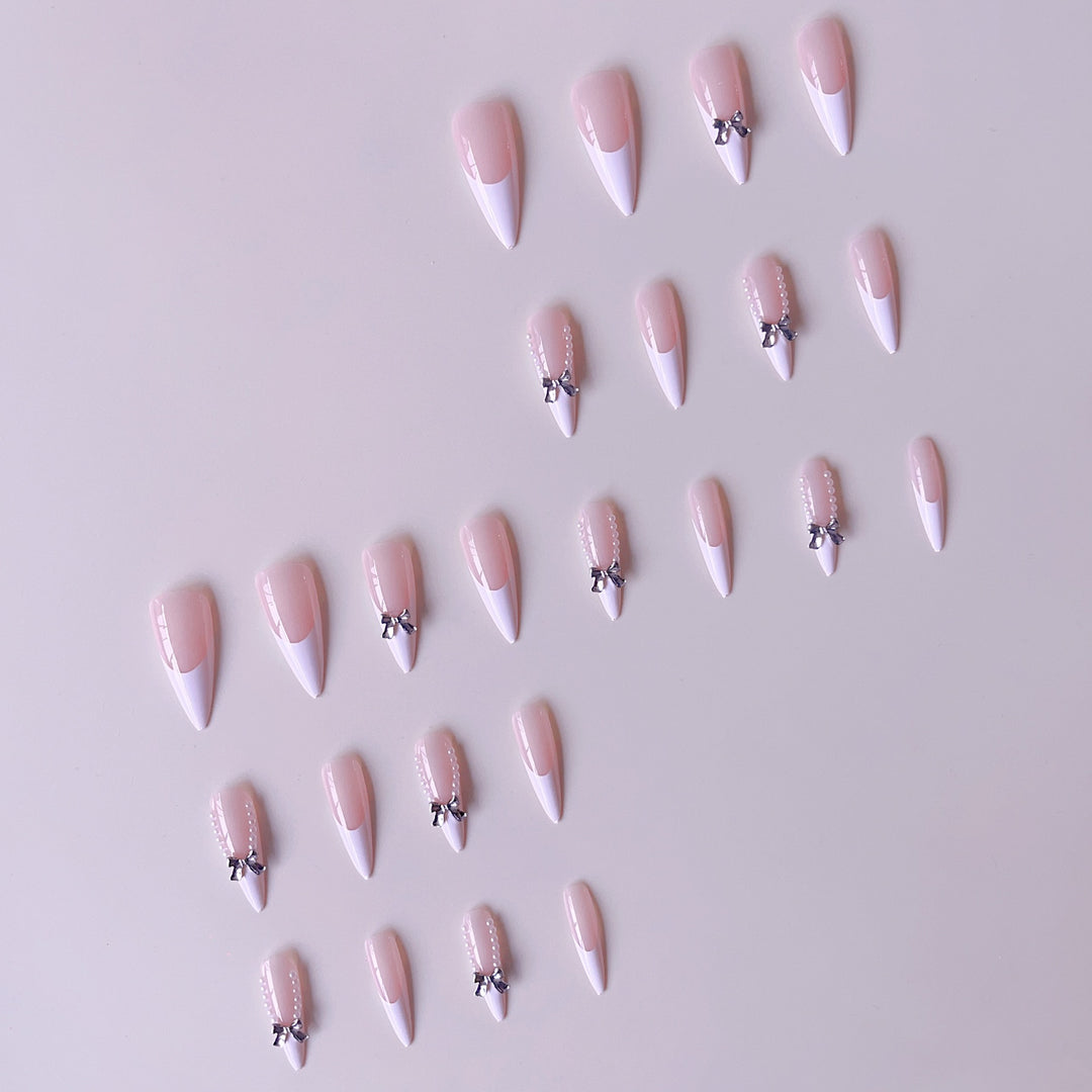Elegant artificial nail set with 3D rhinestone details and pointed accents Stornfield