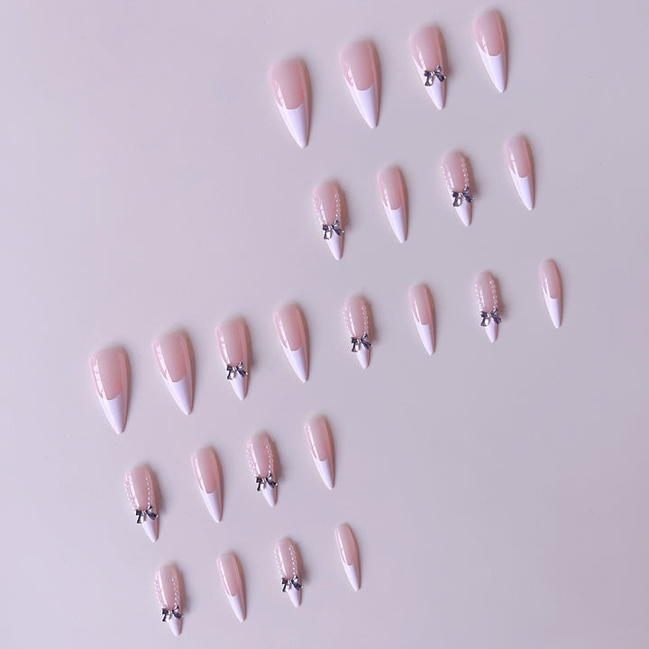 Elegant artificial nail set with 3D rhinestone details and pointed accents Stornfield