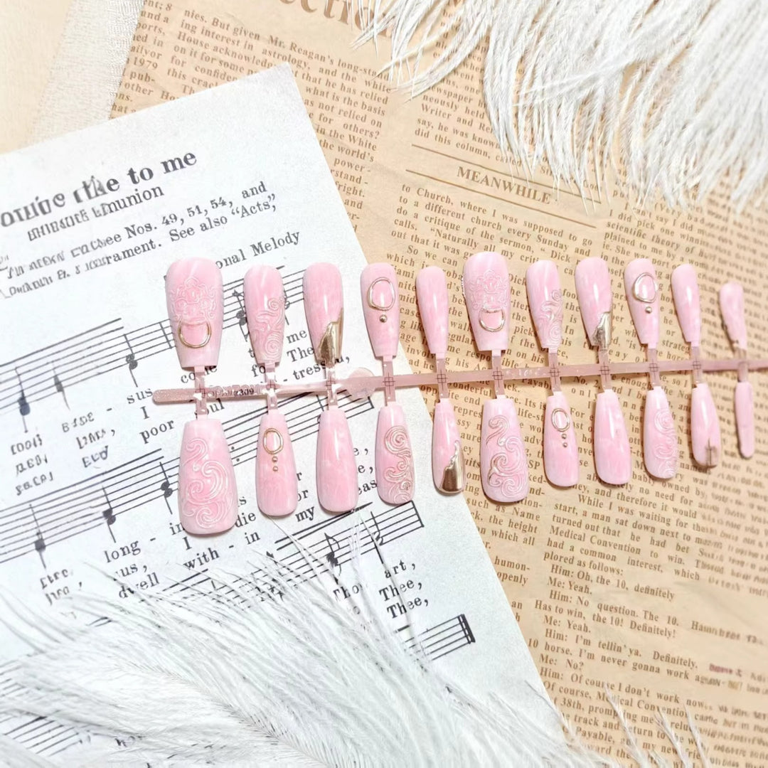 Artificial nails with elegant gold embellishments Stornfield
