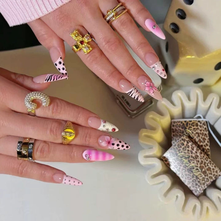 Artistic Press-On Nail Design with Unique Patterns and Rhinestone Accents Stornfield