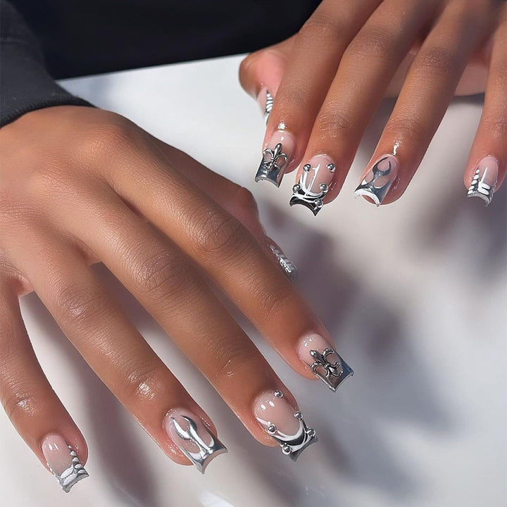 Artistic nail extensions with metallic embellishments Stornfield