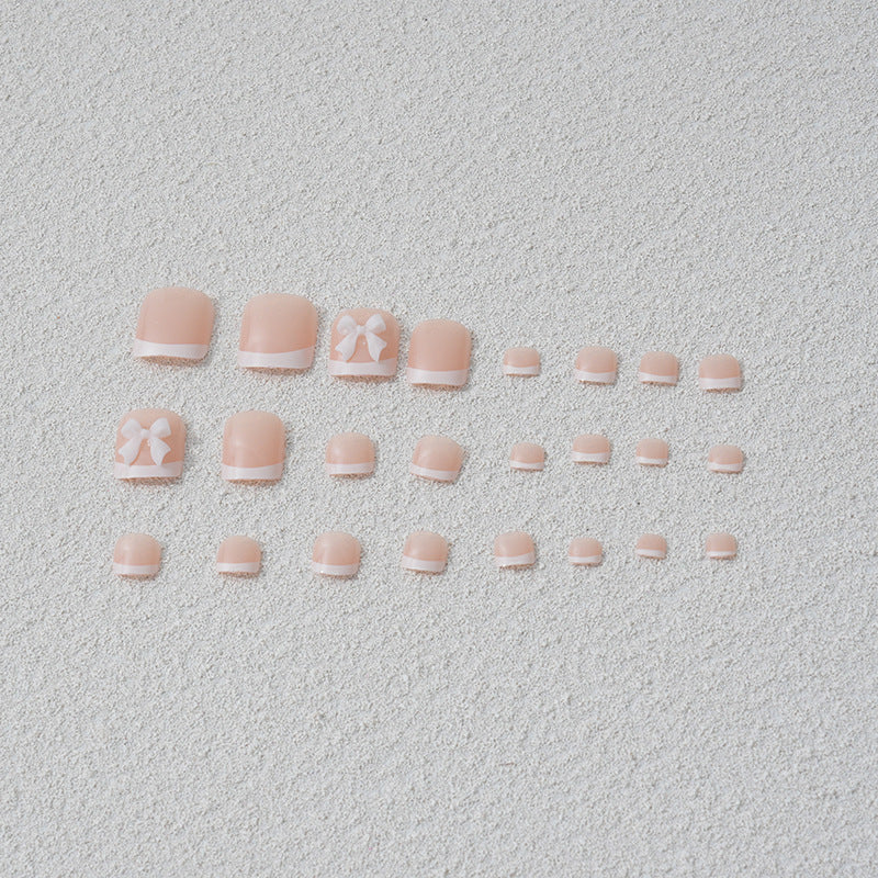 Artificial nail set with romantic bow motifs Stornfield