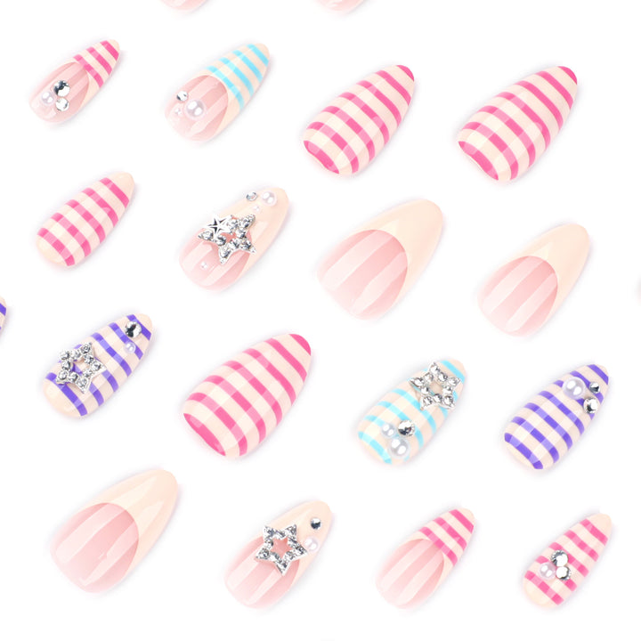 Artistic acrylic stiletto nails with glitter and star embellishments Stornfield